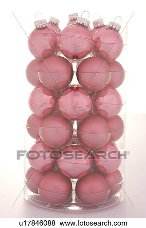 Stock Photo - Red Christmas Tree Decorations Against White Background. Fotosearch