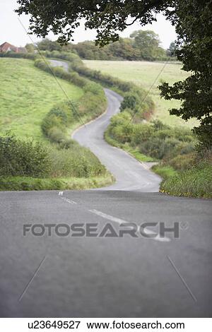 Road Winding Its Way Through The Countryside View Large Photo Image Stock Photo - Road Winding Its Way Through The Countryside. Fotosearch