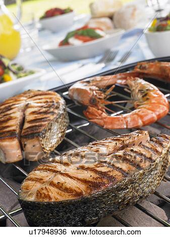 Salmon And Prawns Cooking On A Grill View Large Photo Image Stock Photograph - Salmon And Prawns Cooking On A Grill. Fotosearch