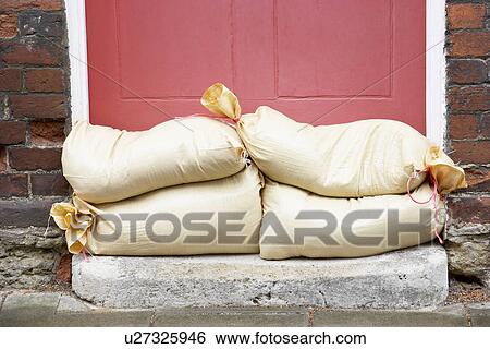 Sandbags Stacked In A Doorway In Preparation For Flooding View Large Photo Image Stock Photograph - Sandbags Stacked In A Doorway In Preparation For Flooding. Fotosearch