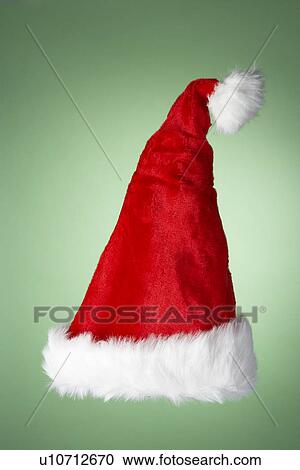 Santa Hat Against Green Background View Large Photo Image Stock Image - Santa Hat Against Green Background. Fotosearch
