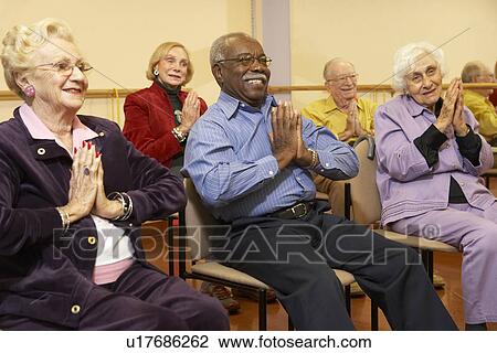 Senior adults in a stretching class View Large Photo Image Stock Image - Senior adults in a stretching class. Fotosearch