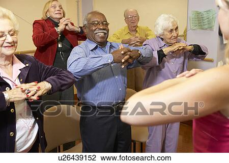 Senior adults in a stretching class View Large Photo Image Stock Image - Senior adults in a stretching class. Fotosearch