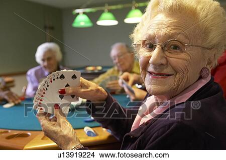 Picture - Senior adults playing bridge. Fotosearch