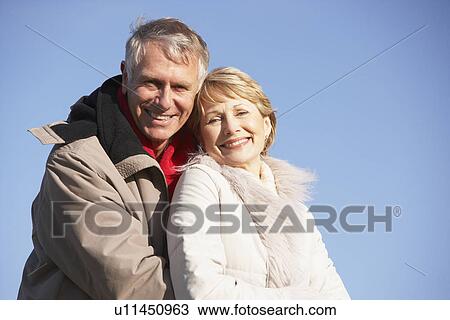 Senior Couple Embracing In Park View Large Photo Image Stock Image - Senior Couple Embracing In Park. Fotosearch
