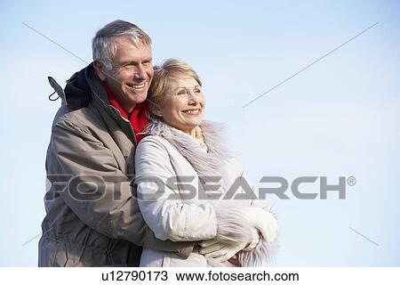 Senior Couple Embracing In Park View Large Photo Image Stock Image - Senior Couple Embracing In Park. Fotosearch