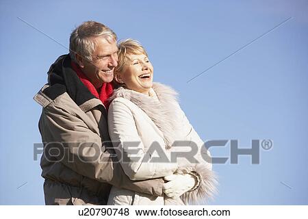 Senior Couple Embracing In Park View Large Photo Image Stock Photo - Senior Couple Embracing In Park. Fotosearch