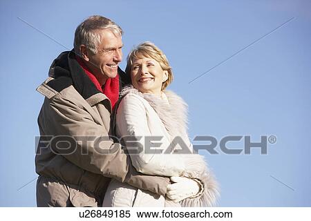 Senior Couple Embracing In Park View Large Photo Image Stock Photography - Senior Couple Embracing In Park. Fotosearch