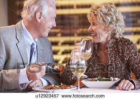 Senior Couple Having Dinner Together At A Restaurant View Large Photo Image Stock Photo - Senior Couple Having Dinner Together At A Restaurant. Fotosearch