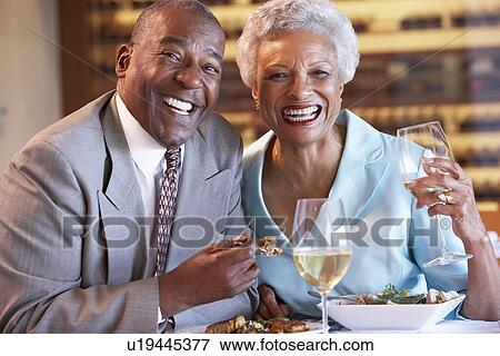 Senior Couple Having Dinner Together At A Restaurant View Large Photo Image Stock Photo - Senior Couple Having Dinner Together At A Restaurant. Fotosearch