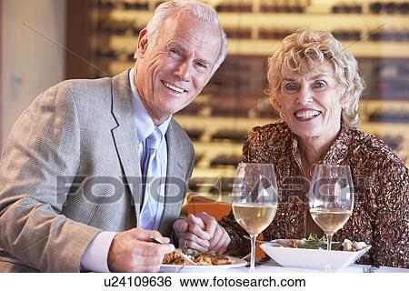 Senior Couple Having Dinner Together At A Restaurant View Large Photo Image Stock Photograph - Senior Couple Having Dinner Together At A Restaurant. Fotosearch