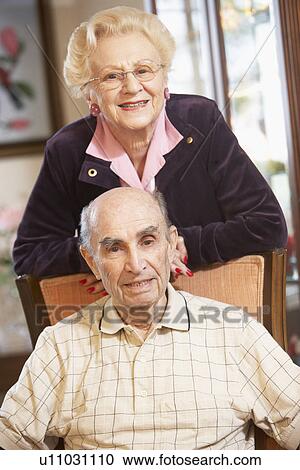 Senior couple relaxing in armchairs View Large Photo Image Stock Image - Senior couple relaxing in armchairs. Fotosearch