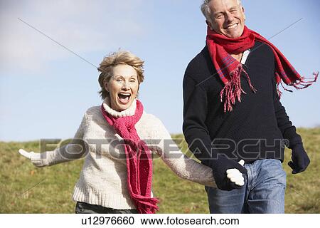 Senior Couple Running In The Park View Large Photo Image Stock Image - Senior Couple Running In The Park. Fotosearch