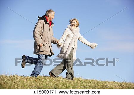 Senior Couple Running In The Park View Large Photo Image Stock Image - Senior Couple Running In The Park. Fotosearch