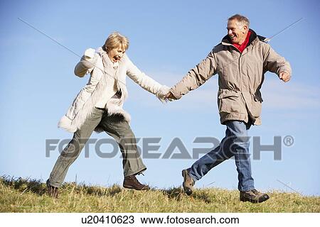 Senior Couple Running In The Park View Large Photo Image Stock Image - Senior Couple Running In The Park. Fotosearch