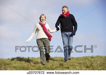Senior Couple Running In The Park View Large Photo Image Stock Image - Senior Couple Running In The Park. Fotosearch