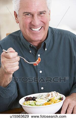 Senior Man Eating A Healthy Meal View Large Photo Image Stock Photo - Senior Man Eating A Healthy Meal. Fotosearch