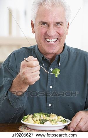 Senior Man Eating A Healthy Meal View Large Photo Image Stock Photo - Senior Man Eating A Healthy Meal. Fotosearch