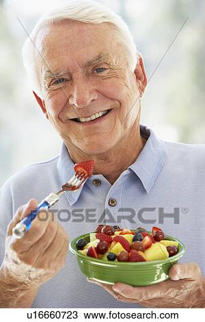 Senior Man Eating Fresh Fruit Salad View Large Photo Image Stock Image - Senior Man Eating Fresh Fruit Salad. Fotosearch