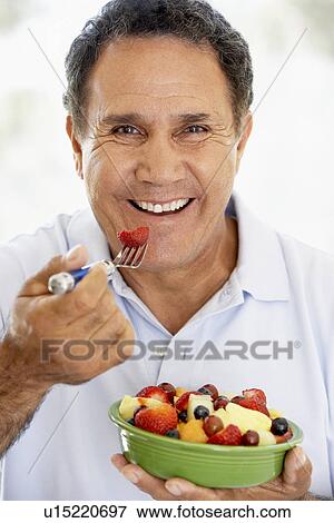 Senior Man Eating Fresh Fruit Salad View Large Photo Image Stock Photo - Senior Man Eating Fresh Fruit Salad. Fotosearch