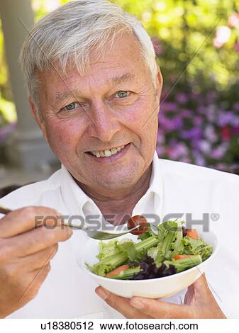 Senior Man Eating Fresh Salad View Large Photo Image Stock Image - Senior Man Eating Fresh Salad. Fotosearch