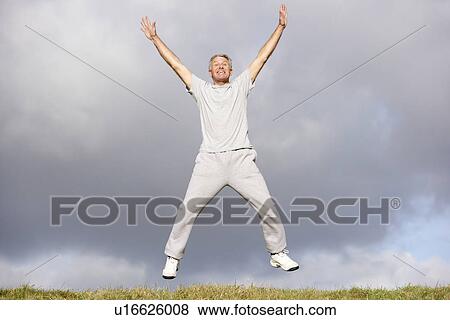 Stock Photo - Senior Man Jumping In The Air. Fotosearch
