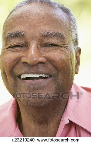 Stock Image - Senior Man Laughing At The Camera. Fotosearch