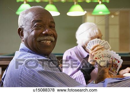 Senior man playing bridge View Large Photo Image Stock Photo - Senior man playing bridge. Fotosearch