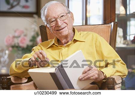 Senior man reading book View Large Photo Image Stock Photo - Senior man reading book. Fotosearch
