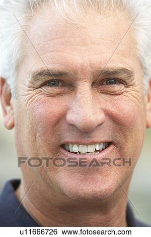 Stock Photograph - Senior Man Smiling At The Camera. Fotosearch