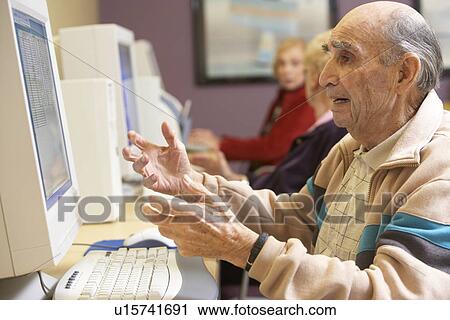 Senior man using computer View Large Photo Image Stock Image - Senior man using computer. Fotosearch
