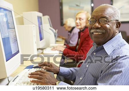 Senior man using computer View Large Photo Image Stock Image - Senior man using computer. Fotosearch