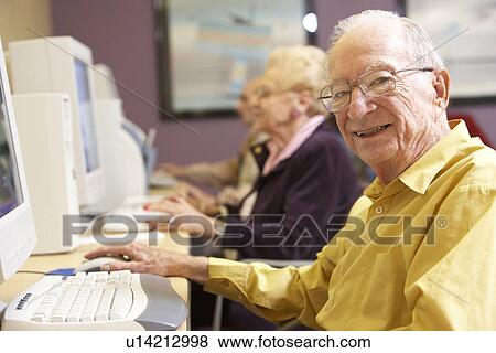 Stock Photo - Senior man using computer. Fotosearch