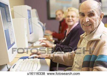 Senior man using computer View Large Photo Image Stock Photo - Senior man using computer. Fotosearch