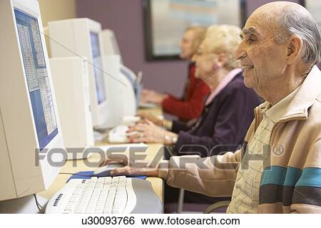 Senior man using computer View Large Photo Image Stock Photograph - Senior man using computer. Fotosearch
