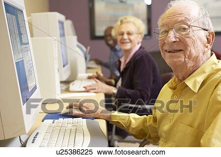 Stock Photography - Senior man using computer. Fotosearch