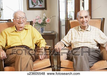 Senior men relaxing in armchairs View Large Photo Image Stock Photo - Senior men relaxing in armchairs. Fotosearch