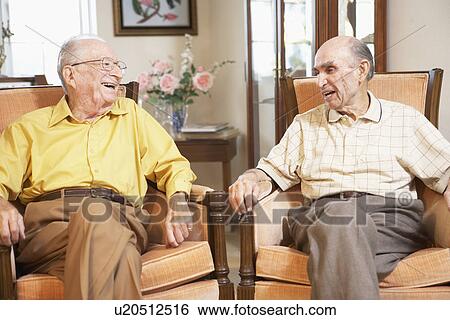 Stock Photograph - Senior men relaxing in armchairs. Fotosearch