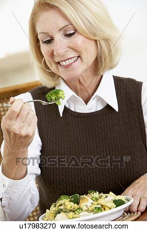 Senior Woman Eating A Healthy Meal View Large Photo Image Stock Image - Senior Woman Eating A Healthy Meal. Fotosearch