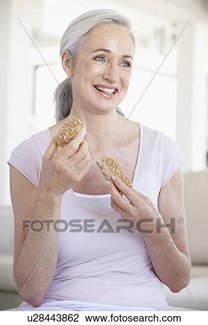 Senior Woman Eating Brown Bread Roll View Large Photo Image Stock Image - Senior Woman Eating Brown Bread Roll. Fotosearch