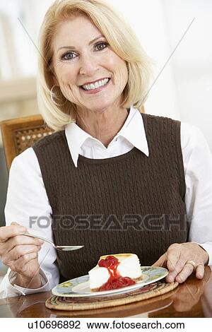 Senior Woman Eating Cheesecake View Large Photo Image Stock Image - Senior Woman Eating Cheesecake. Fotosearch