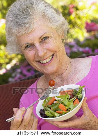 Senior Woman Eating Fresh Salad View Large Photo Image Stock Image - Senior Woman Eating Fresh Salad. Fotosearch