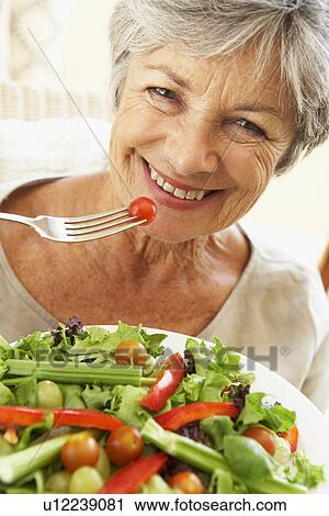 Senior Woman Eating Healthy Salad View Large Photo Image Stock Image - Senior Woman Eating Healthy Salad. Fotosearch