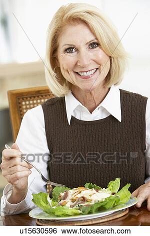 Senior Woman Eating Salad View Large Photo Image Stock Photograph - Senior Woman Eating Salad. Fotosearch