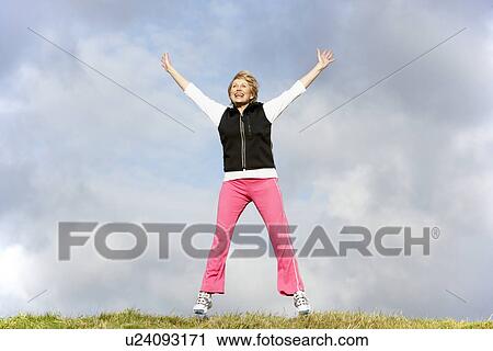 Senior Woman Jumping In The Air View Large Photo Image Stock Image - Senior Woman Jumping In The Air. Fotosearch