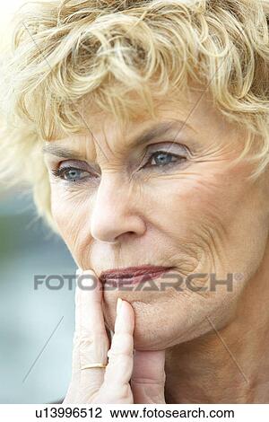Stock Image - Senior Woman Lost In Thought. Fotosearch