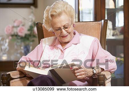 Stock Photo - Senior woman reading book. Fotosearch