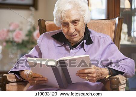 Stock Photo - Senior woman reading book. Fotosearch