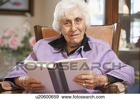 Stock Photo - Senior woman reading book. Fotosearch