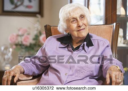Senior woman relaxing in chair View Large Photo Image Stock Image - Senior woman relaxing in chair. Fotosearch
